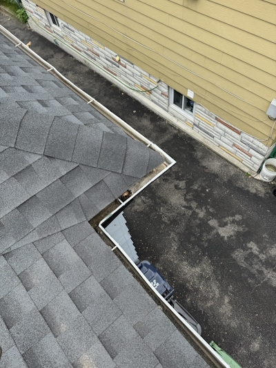 Professional eavestrough repair on a brick home in Toronto