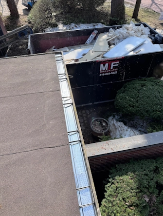 Aluminum leaf guards installation on a modern two-story home in Mississauga